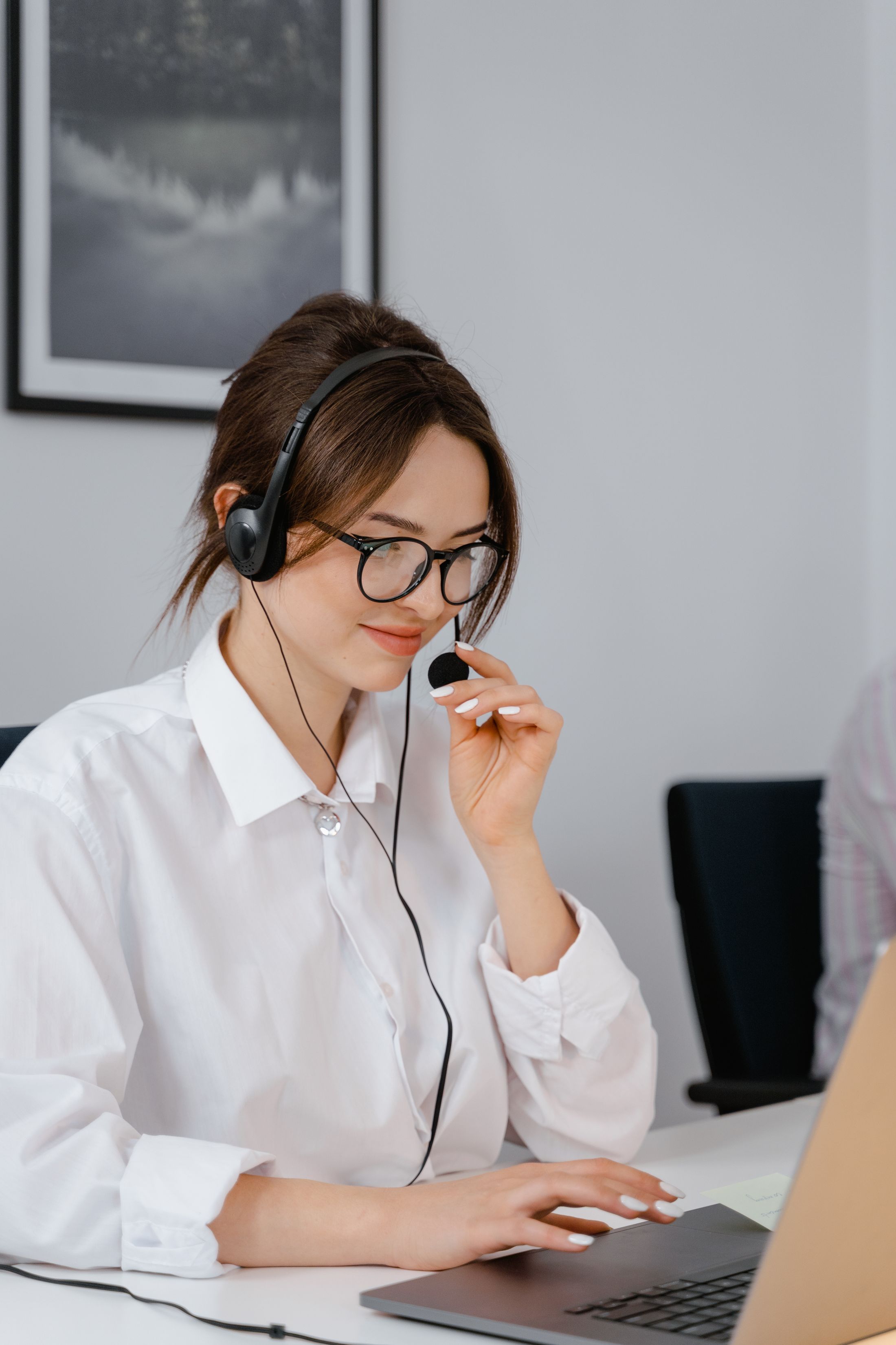 Professional customer support representative answering a business call
